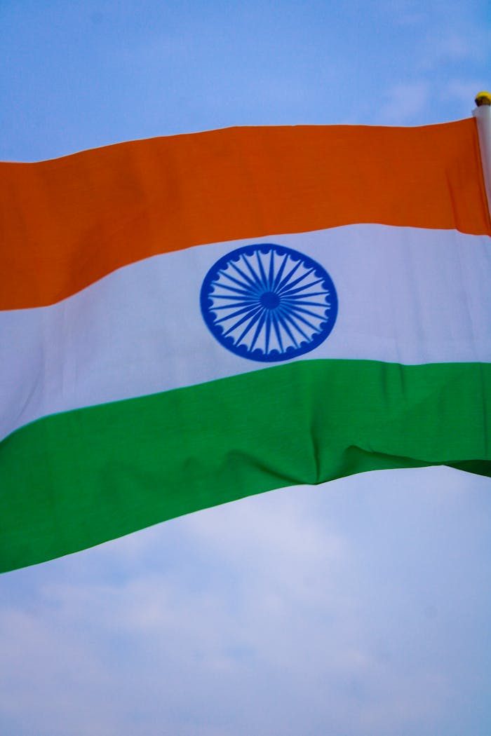 Vibrant Indian national flag waving proudly outdoors, representing patriotism and unity.